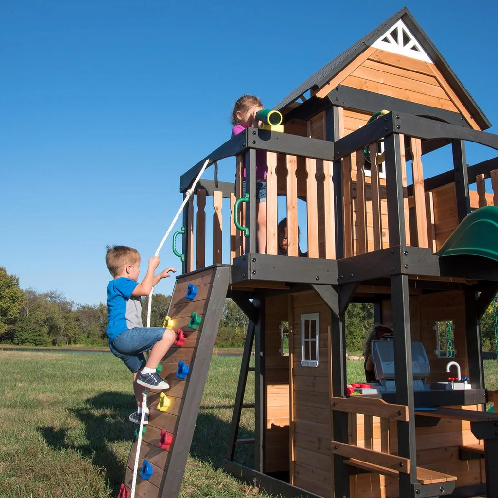 Canyon Creek Cedar Wood Swing Set with Wave Slide, Clubhouse, Play Kitchen, Picnic Area, Belt Swings, Web Swing, Rock Wall, Balconies, Playhouse, Step Ladder, Outdoor Playset